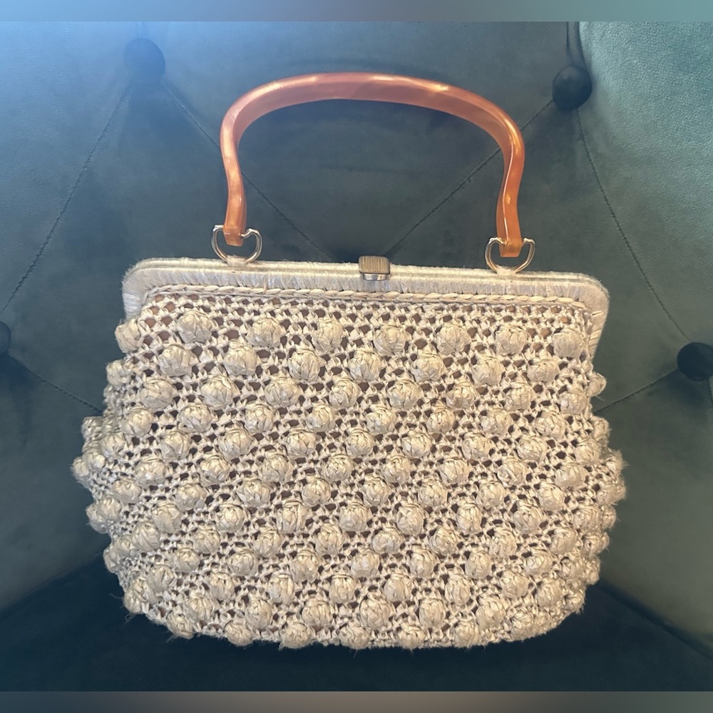 Vintage beige woven raffia purse with orange handle